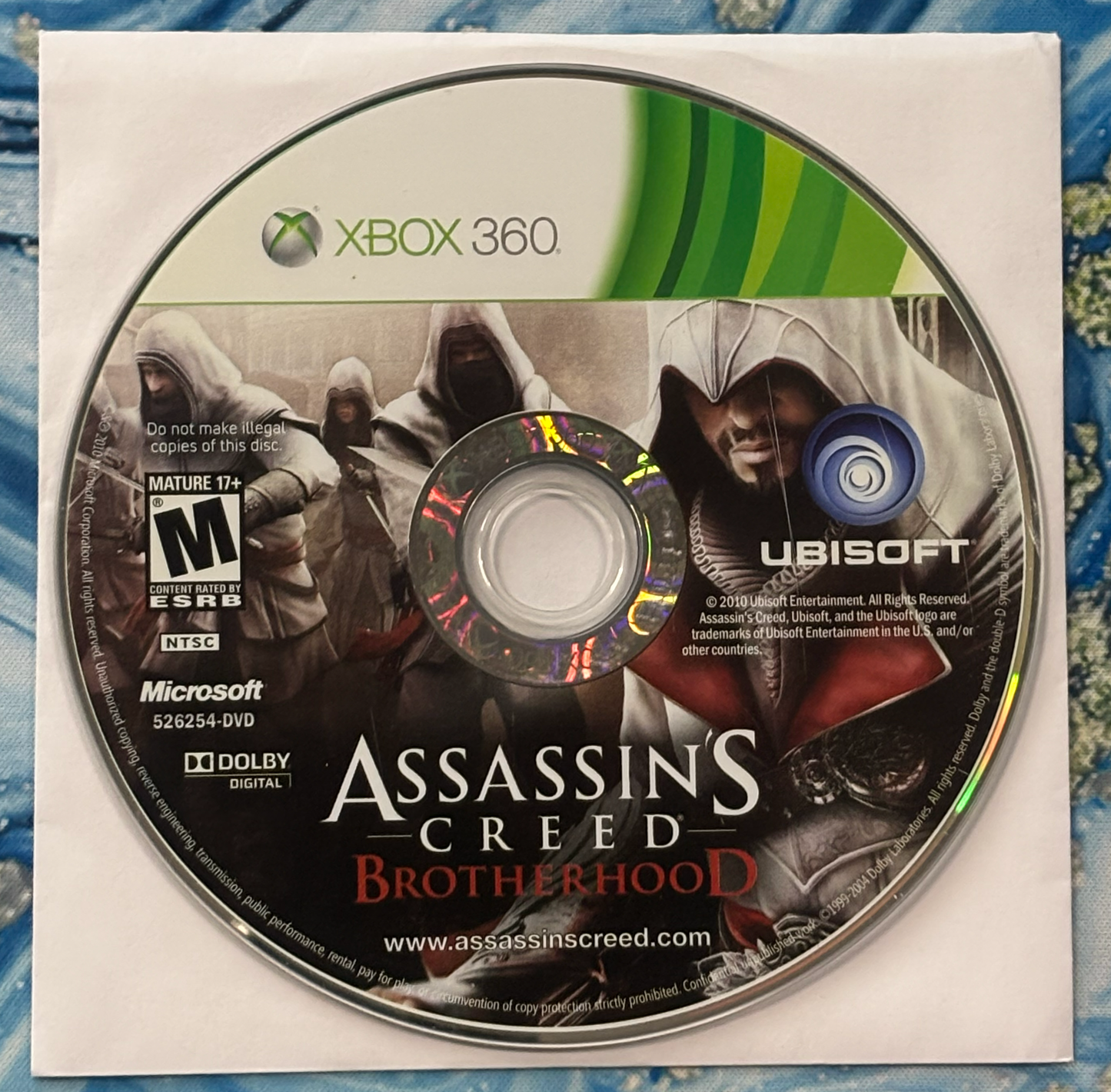 Assassin's Creed Brotherhood Xbox 360 game disc with cover