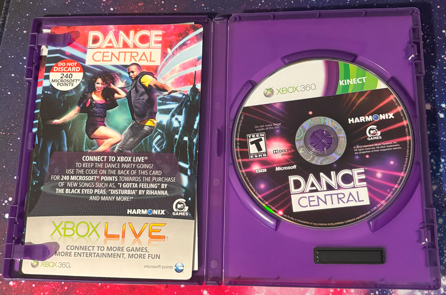 Xbox 360 'Dance Central' game disc and case on a colorful background
