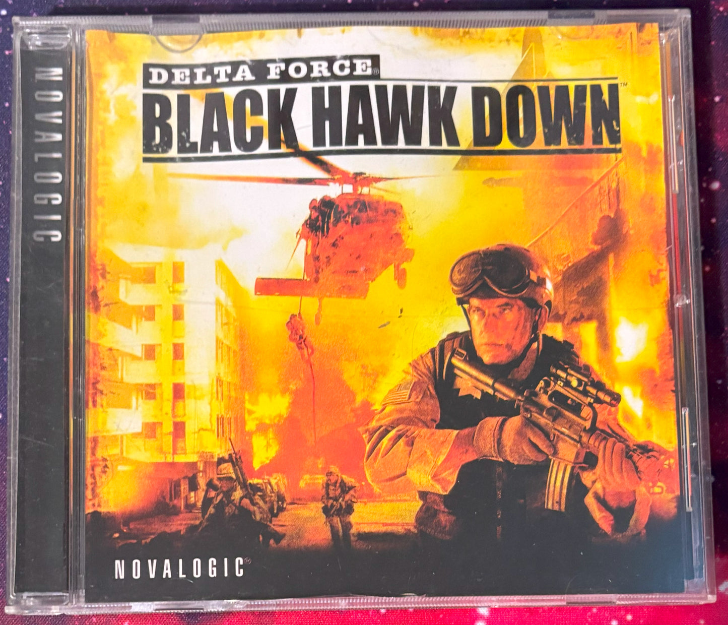 Video game case for 'Black Hawk Down' by Delta Force with a soldier holding a gun on a fiery background.