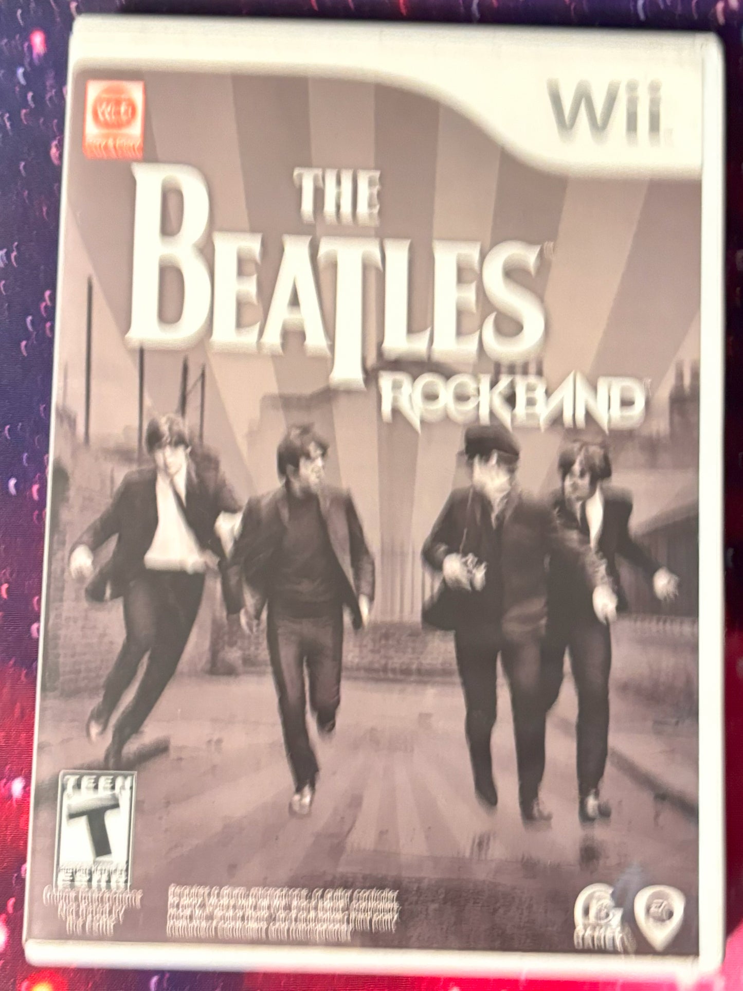 Game box for 'The Beatles Rock Band' on Wii with band members on cover