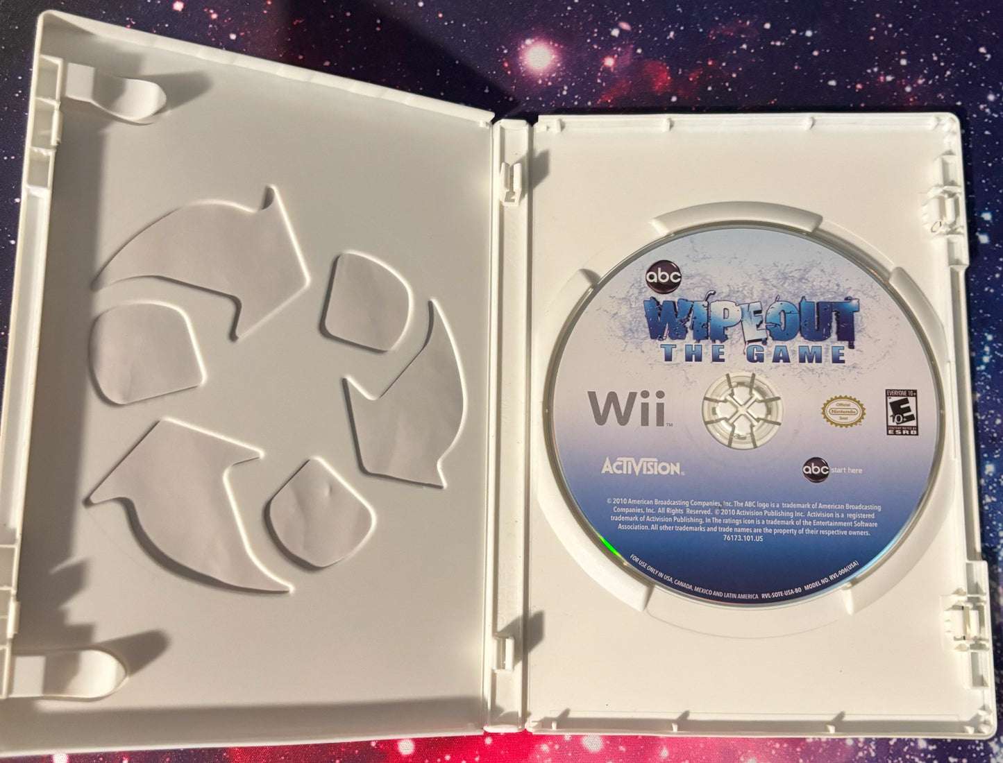 Wii game disc in a case with 'Whoo! The Game' branding on a starry background