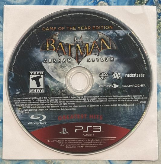 Batman Arkham Asylum Game of the Year Edition disc on a blue and white patterned background