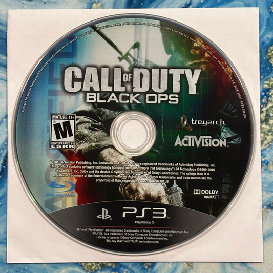 Call of Duty Black Ops PlayStation 3 game disc on a textured surface