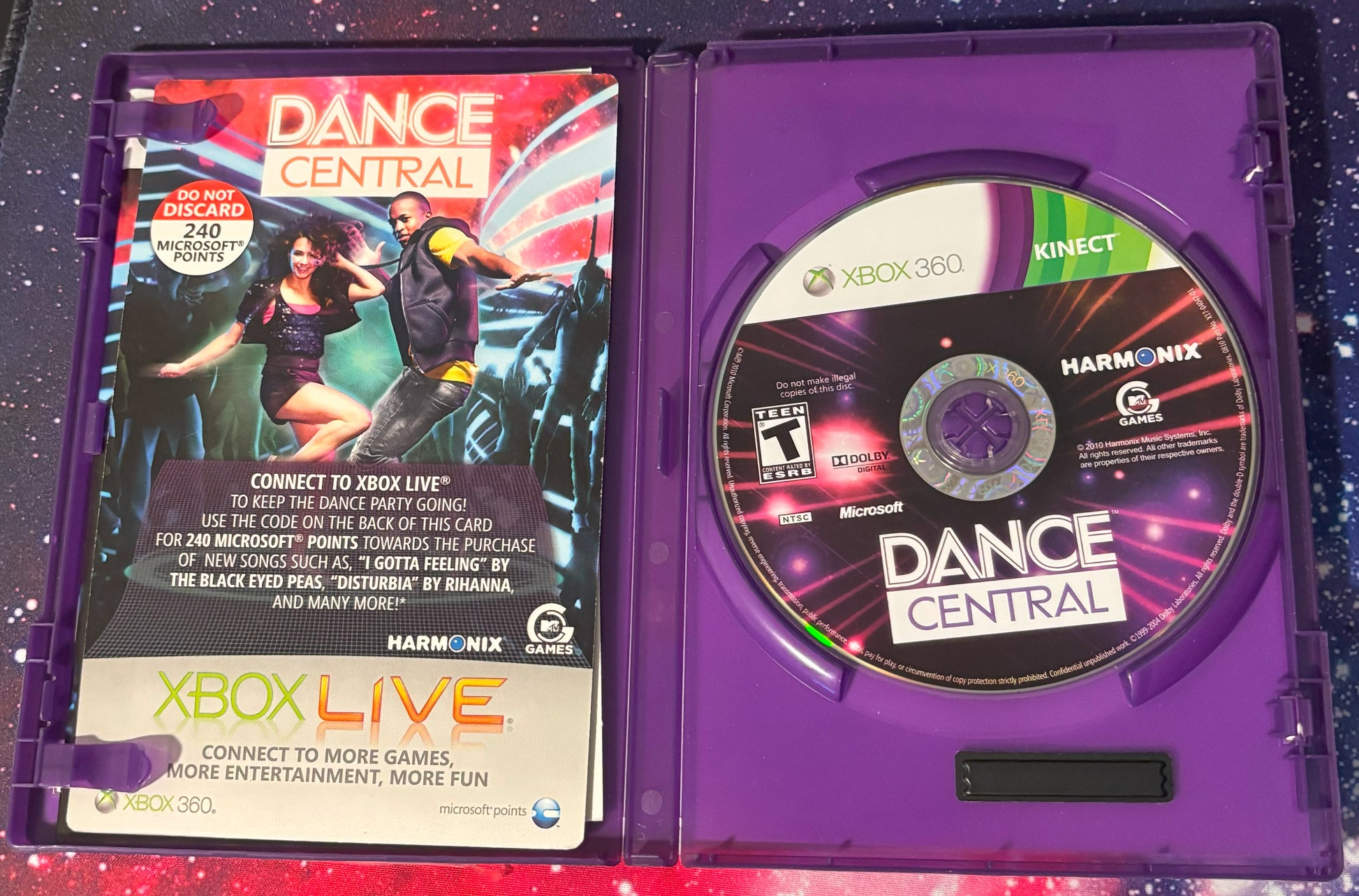 Xbox 360 'Dance Central' game disc and case on a colorful background