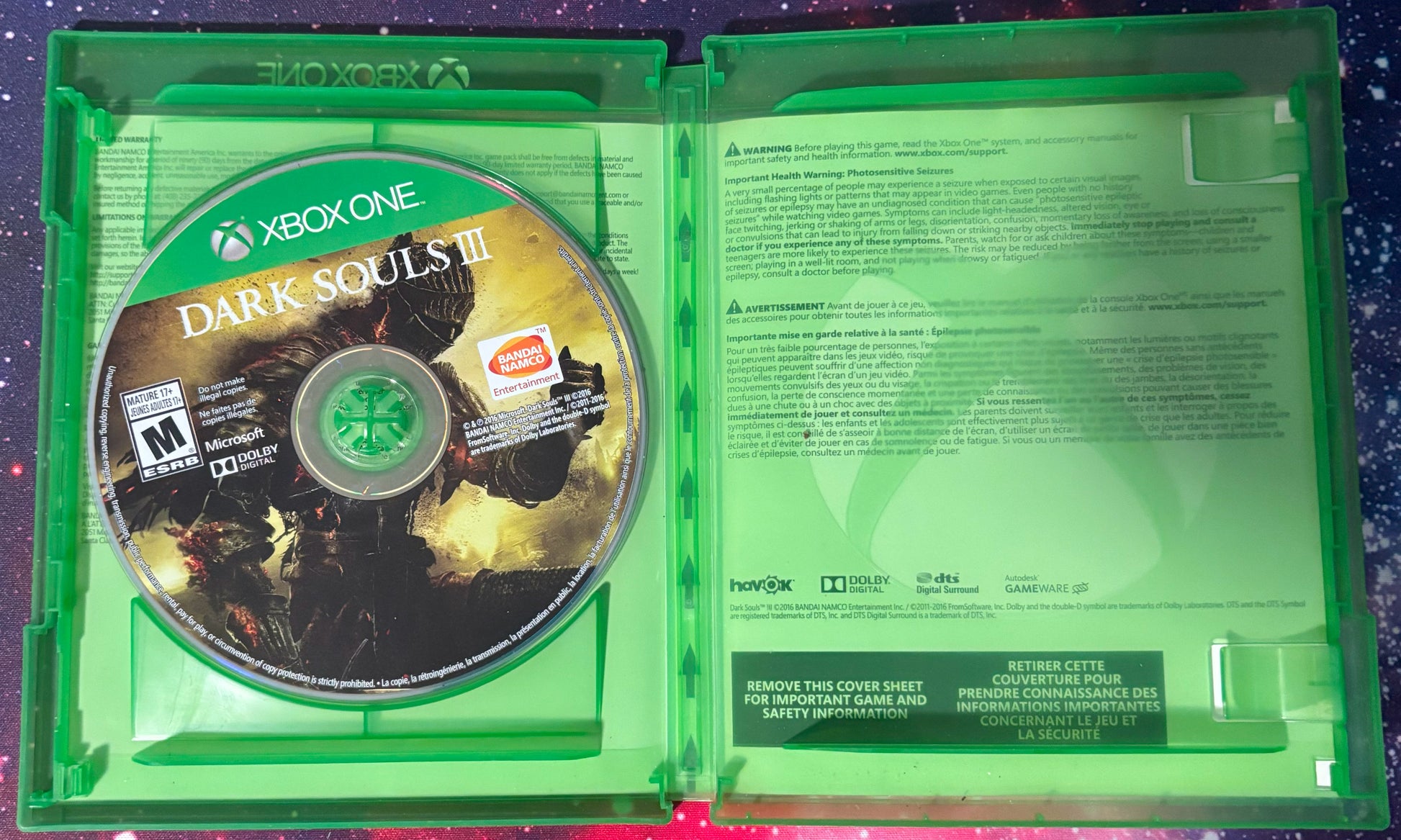 Xbox One game disc in a green case with 'Dark Souls III' branding.