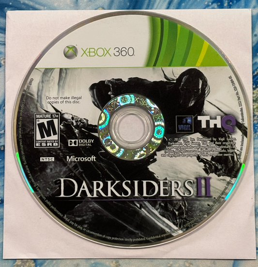 Game disc for 'Darksiders II' on Xbox 360 with THQ logo