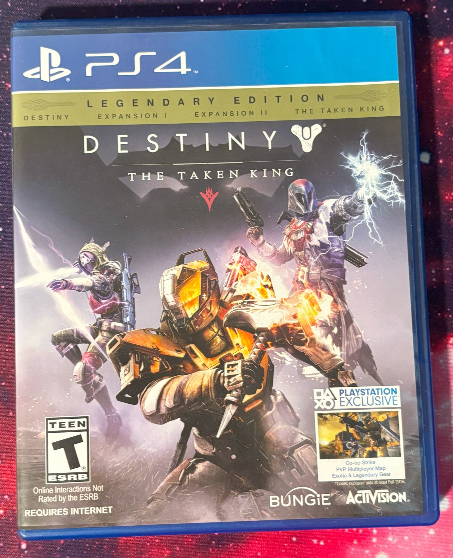 PlayStation 4 game case for 'Destiny: The Taken King' Legendary Edition on a red and black background.