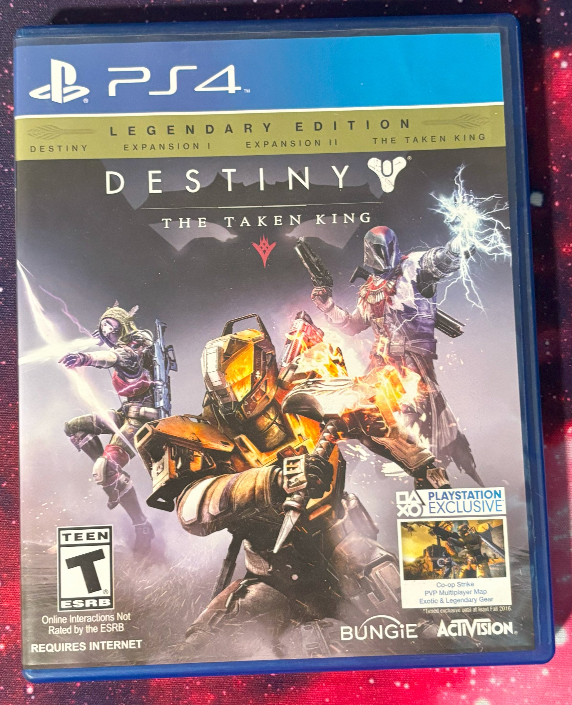 PlayStation 4 game case for 'Destiny: The Taken King' Legendary Edition on a red and black background.