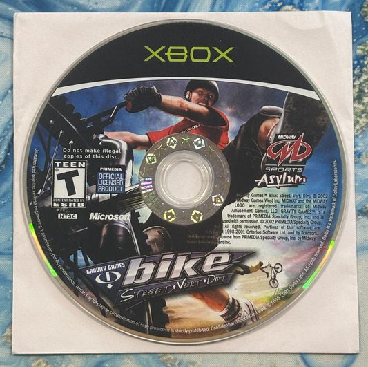 Xbox game disc for 'Bike Street Wild' on a textured surface