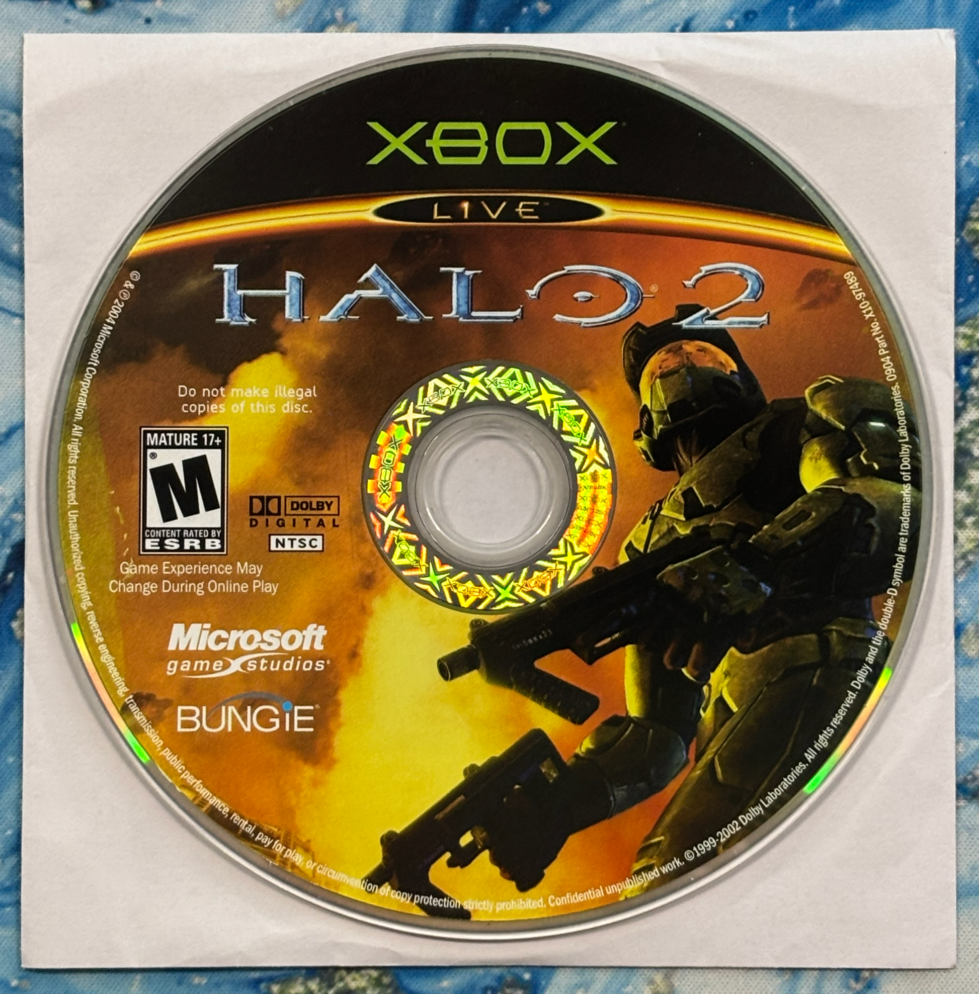 Halo 2 game disc for Xbox with character and branding on a textured surface