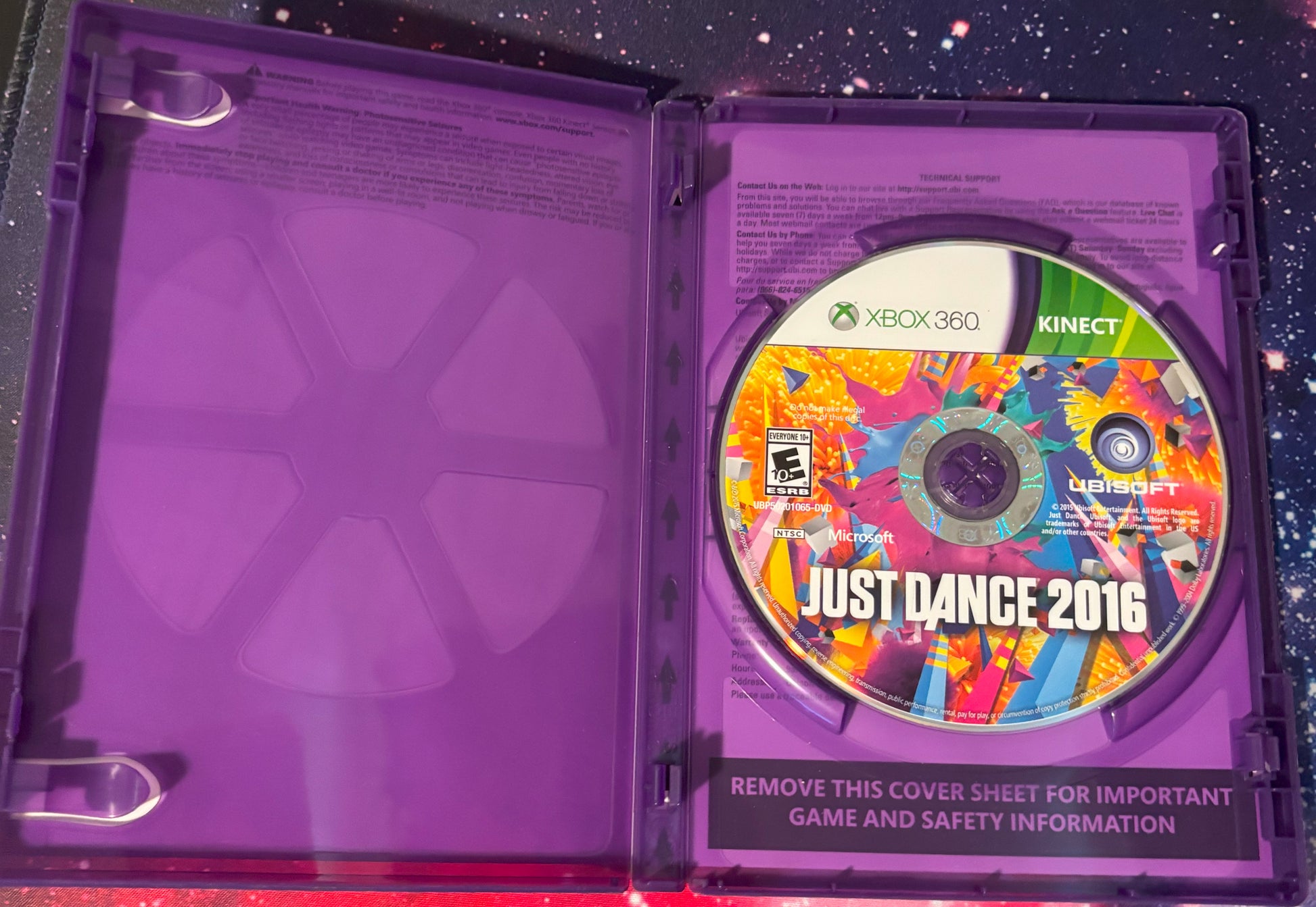 Xbox 360 Kinect game disc for 'Just Dance 2016' in a purple case with a colorful cover.