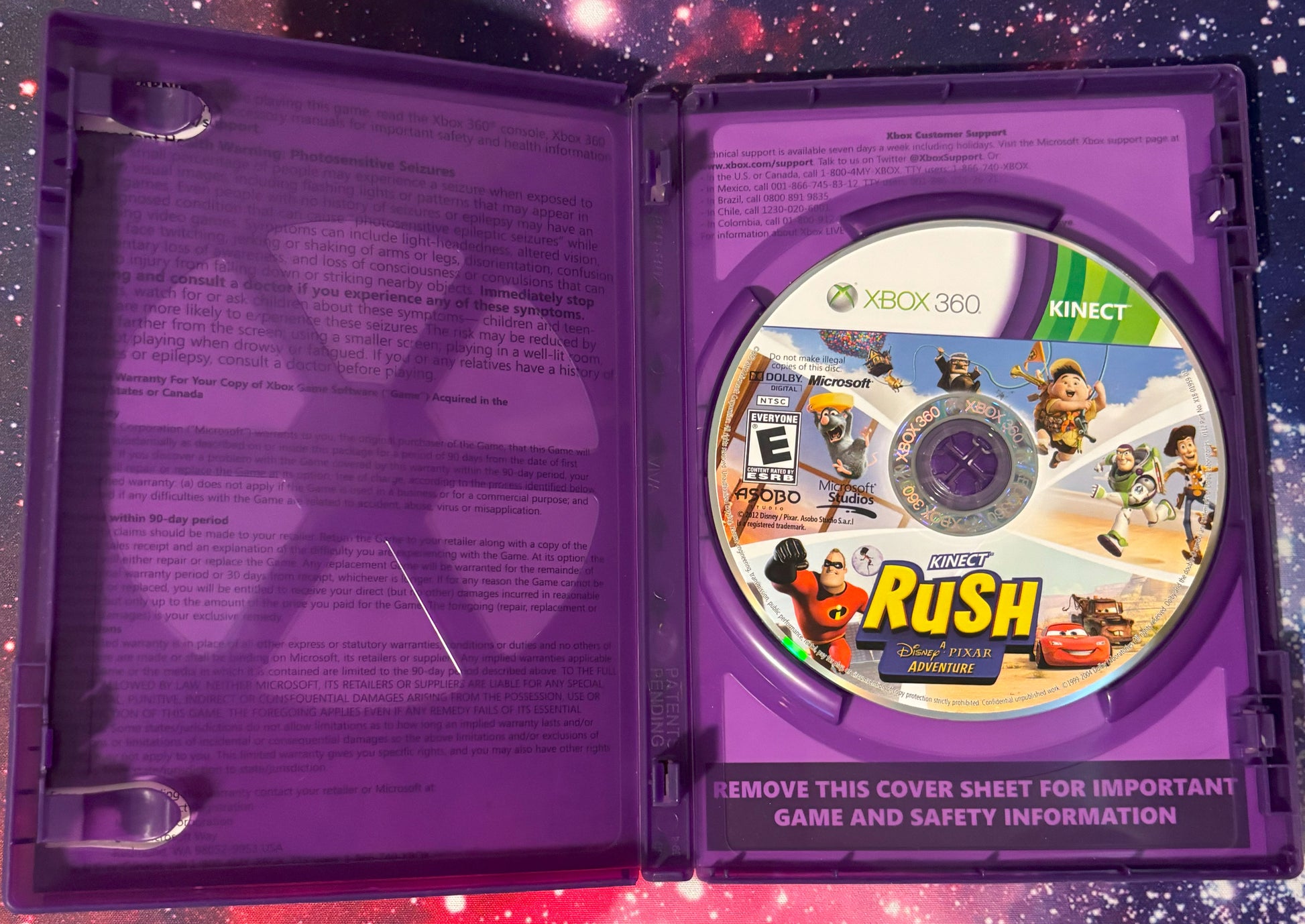 Purple game case with a disc featuring Disney's Planes: Fire & Rescue on a starry background