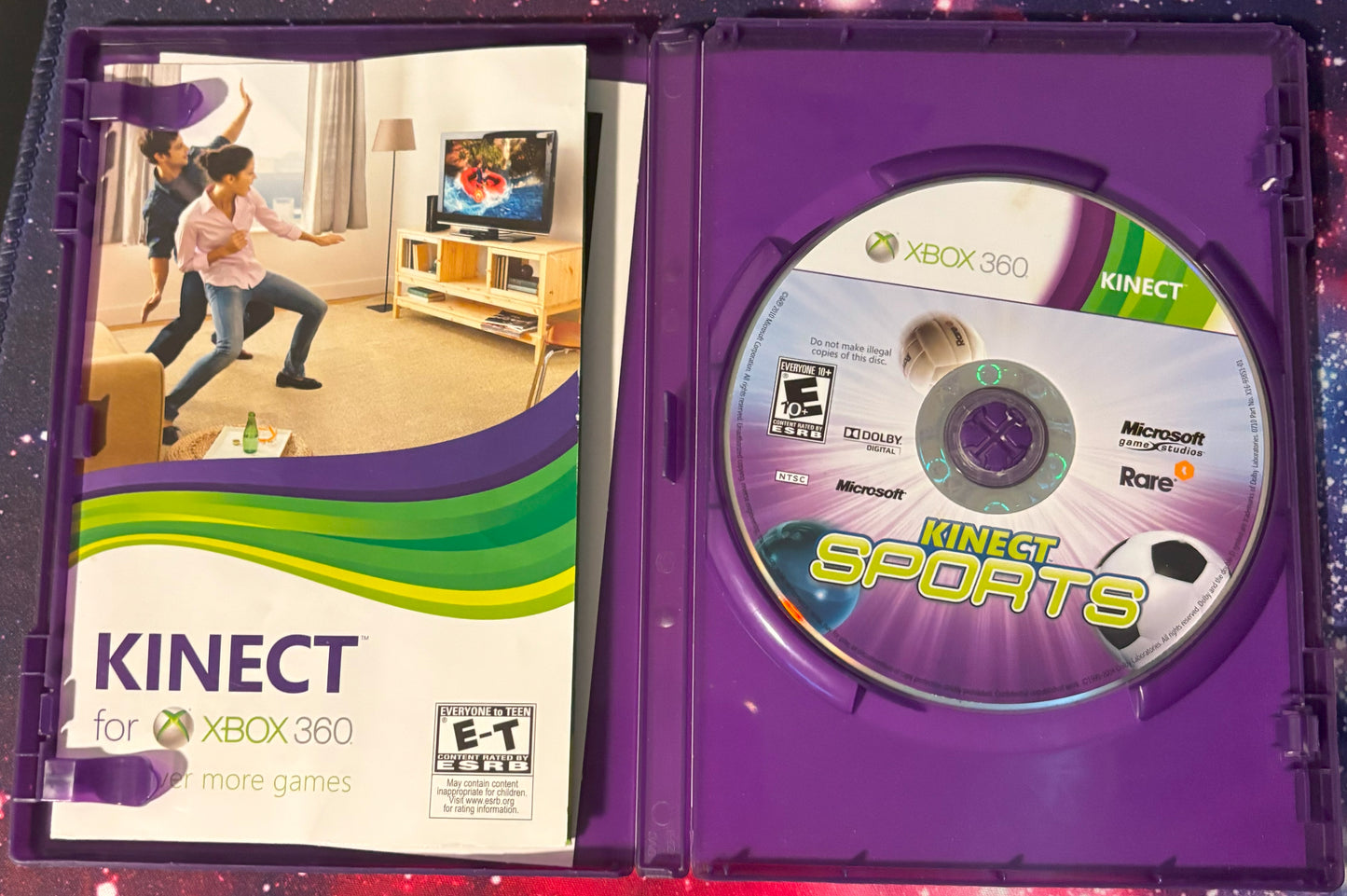 Xbox 360 Kinect Sports game disc and case on a reflective surface