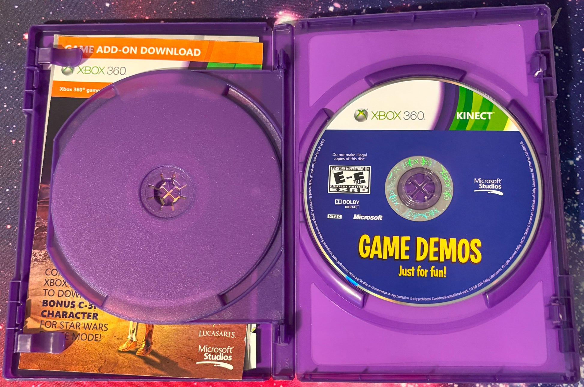Xbox 360 Kinect game demo disc in a purple case with Microsoft branding.