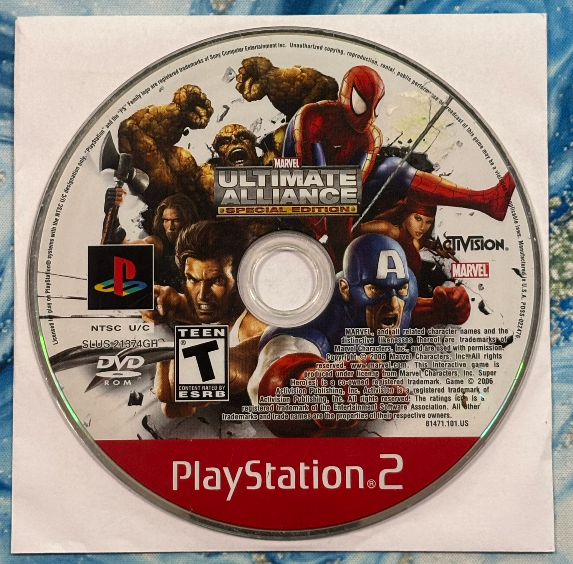 PlayStation 2 game disc for 'Marvel Ultimate Alliance' with superhero characters on a blue textured background.