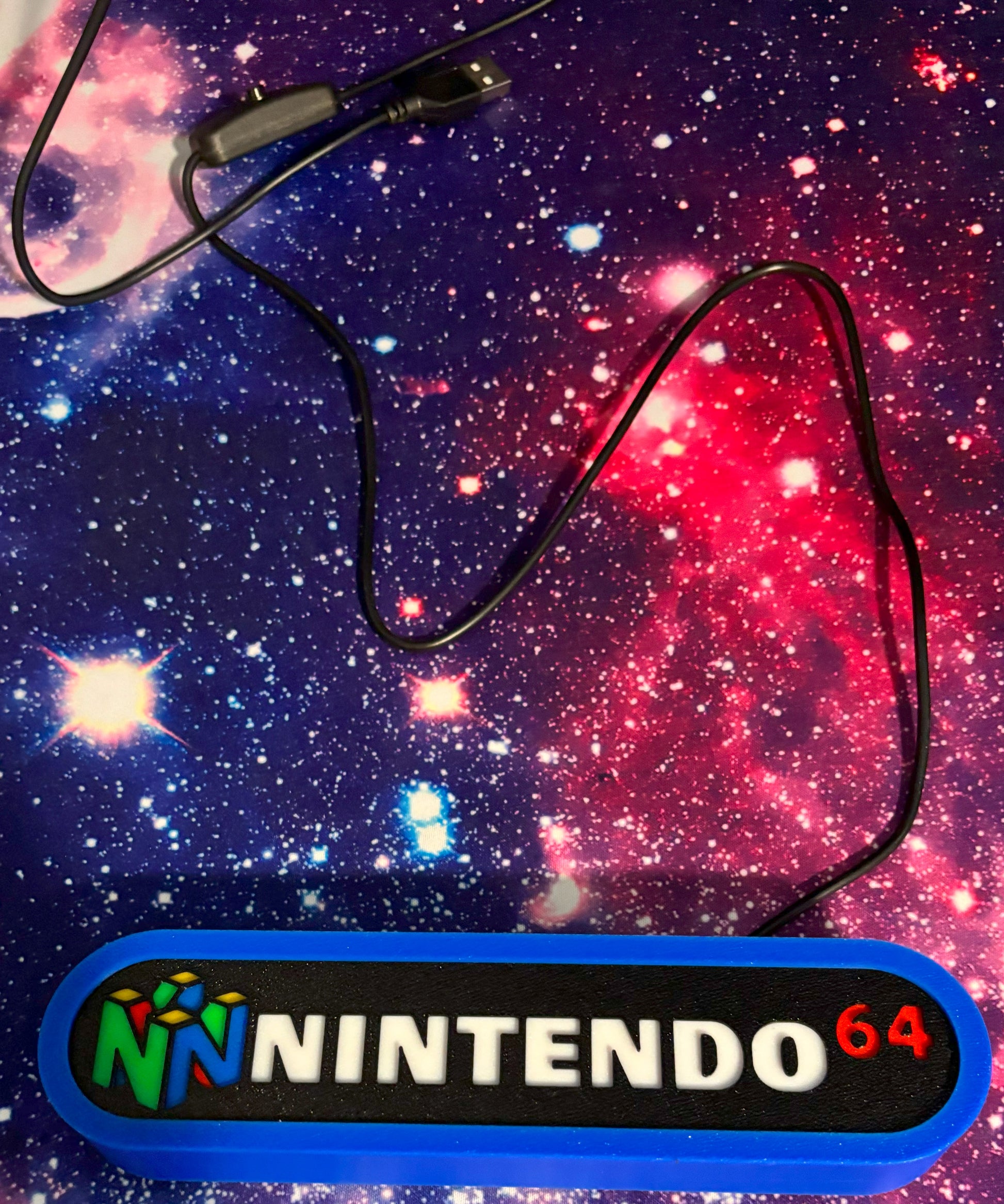 Nintendo 64 controller cable on a starry space background