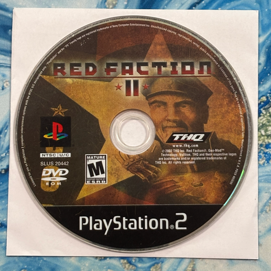 PlayStation 2 game disc for 'Red Faction II' with THQ and PlayStation logos.
