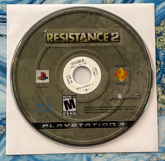 Game disc for 'Resistance 2' on a PlayStation 3 console with branding and logos.