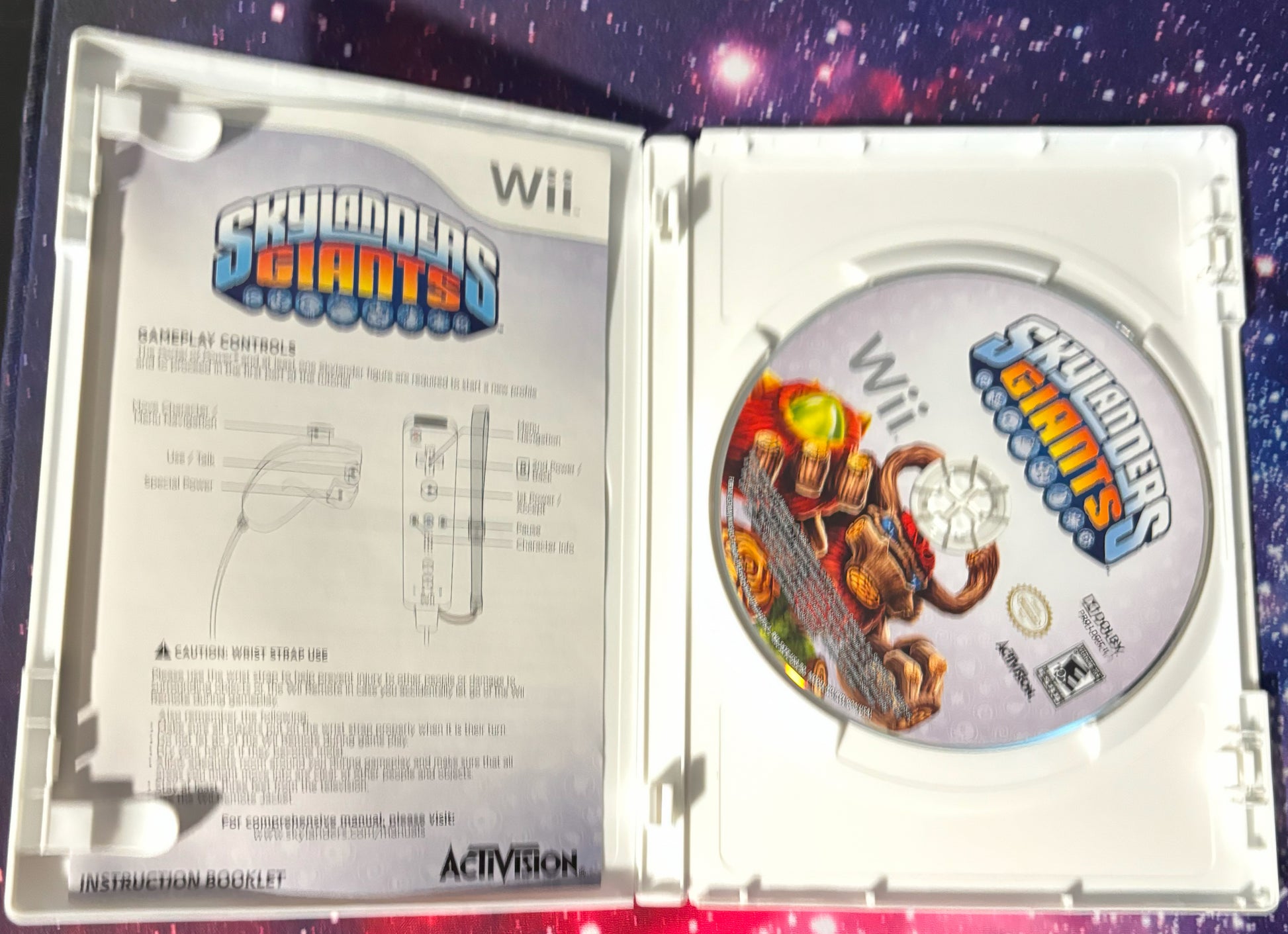 Wii game 'Skyscrapers Giants' with packaging and disc on a colorful background
