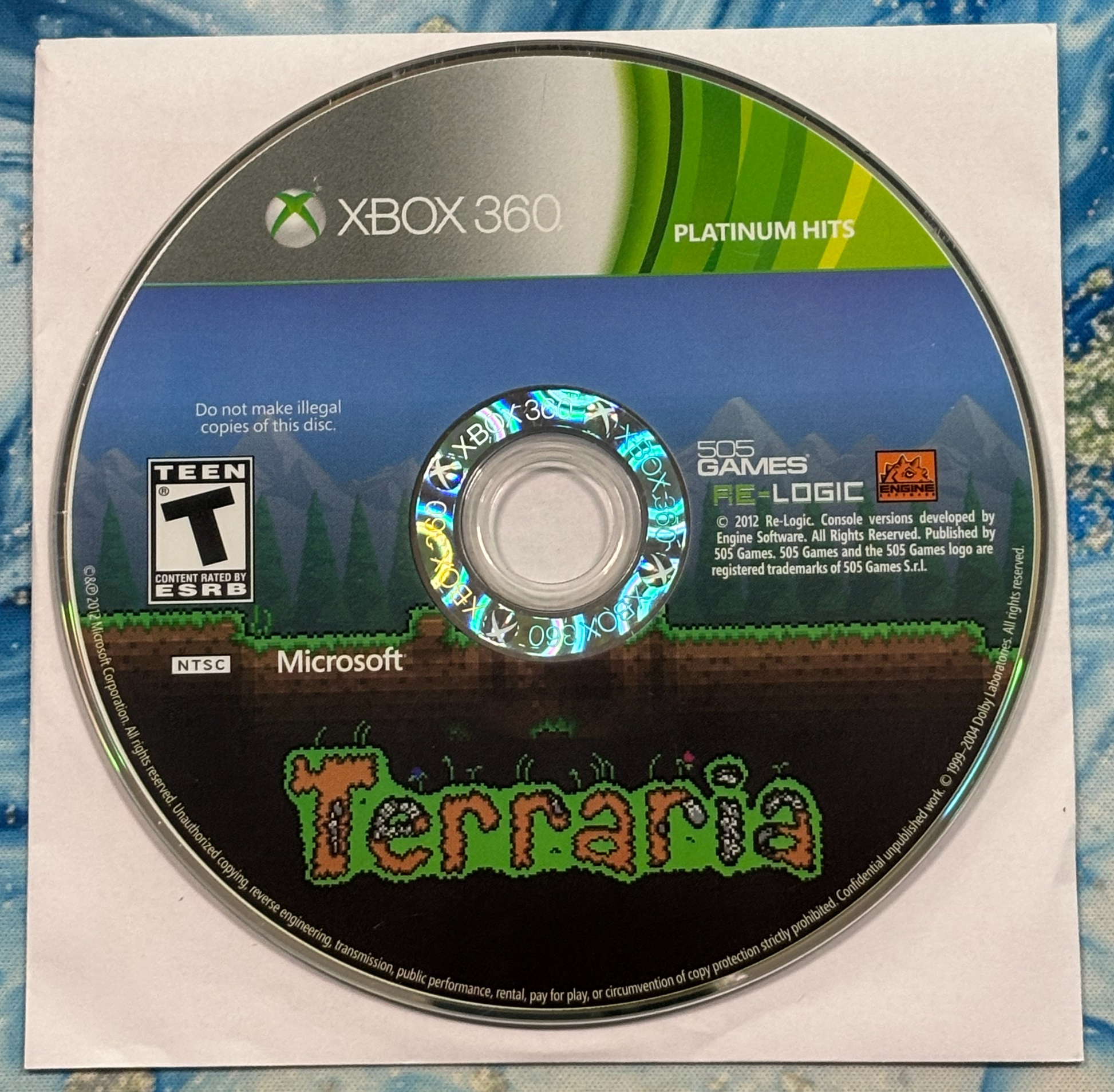 Xbox 360 game disc for 'Terraria' on a white background