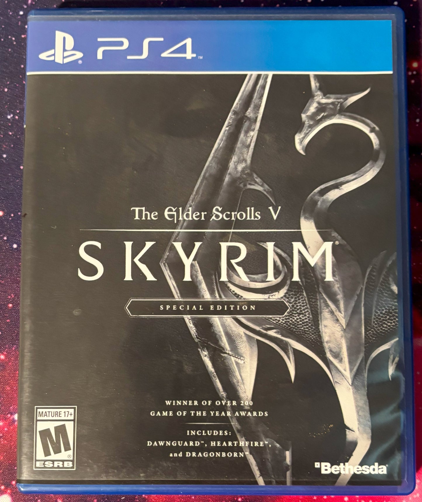 PS4 game case for 'The Elder Scrolls V: Skyrim' Special Edition on a colorful background