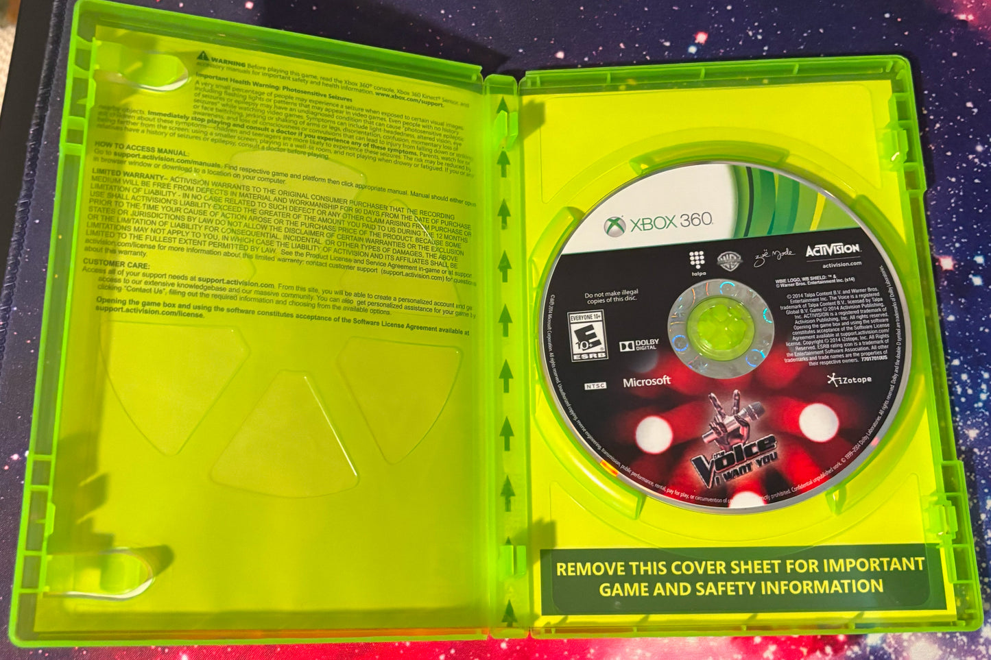 Xbox 360 game disc in a green case with safety information text.