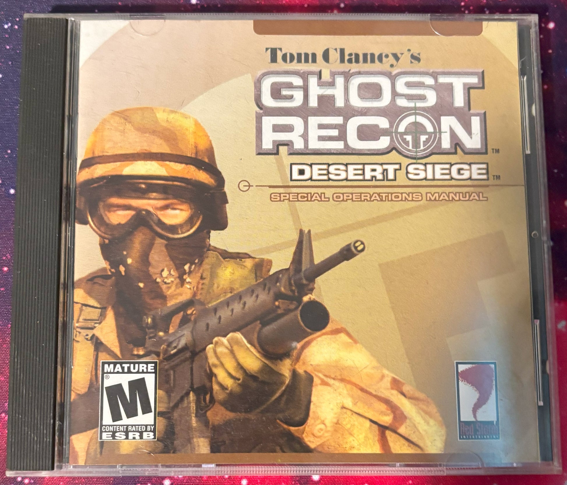 Tom Clancy's Ghost Recon Desert Siege game case with a soldier holding a rifle on a red and purple gradient background.