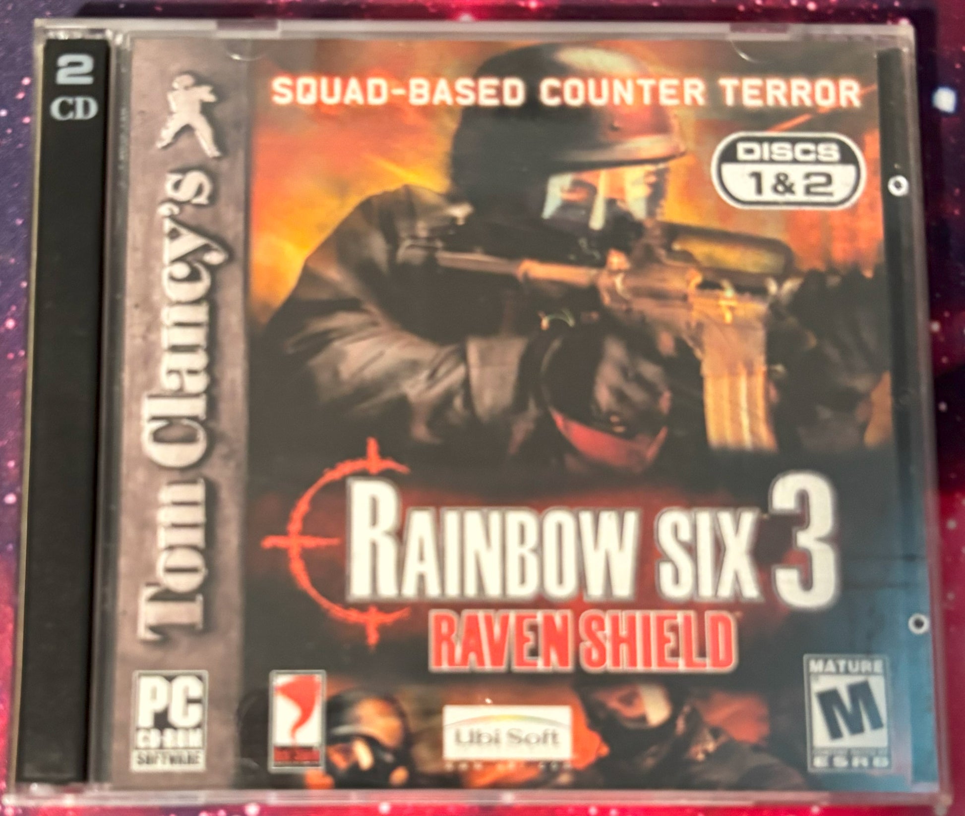 Tom Clancy's Rainbow Six 3 Raven Shield game case with a soldier holding a rifle on the cover.