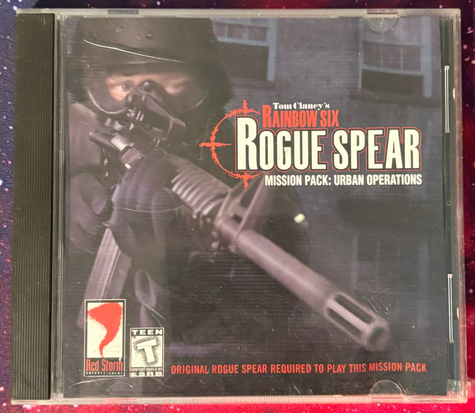 Tom Clancy's Rainbow Six Rogue Spear Mission Pack: Urban Operations on a CD case.