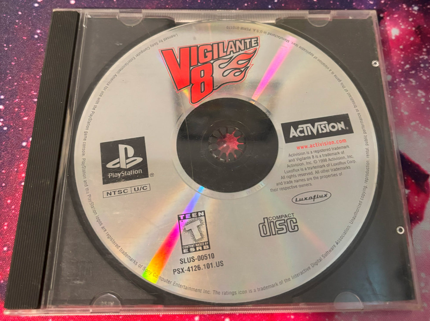 Vigilante 8 PlayStation game disc with Activision logo on a colorful background
