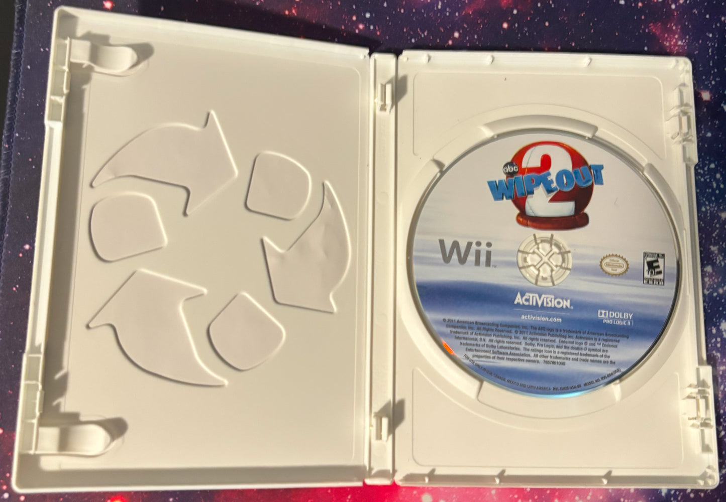 Wii game disc in a case with 'Wii Out' branding on a colorful background